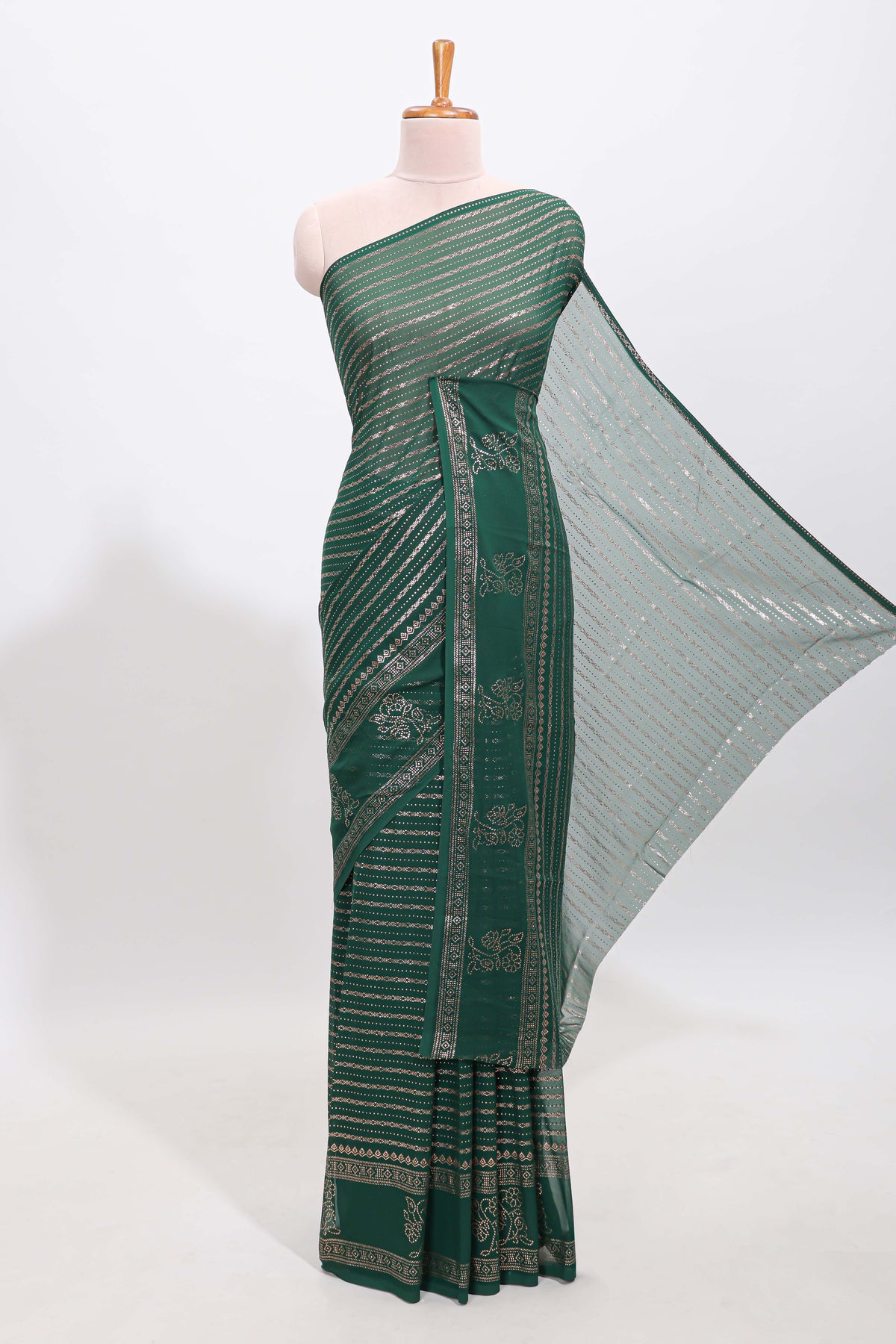 Green vertical zari design georgette saree with self floral design border and matching blouse