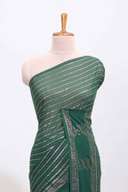 Green vertical zari design georgette saree with self floral design border and matching blouse