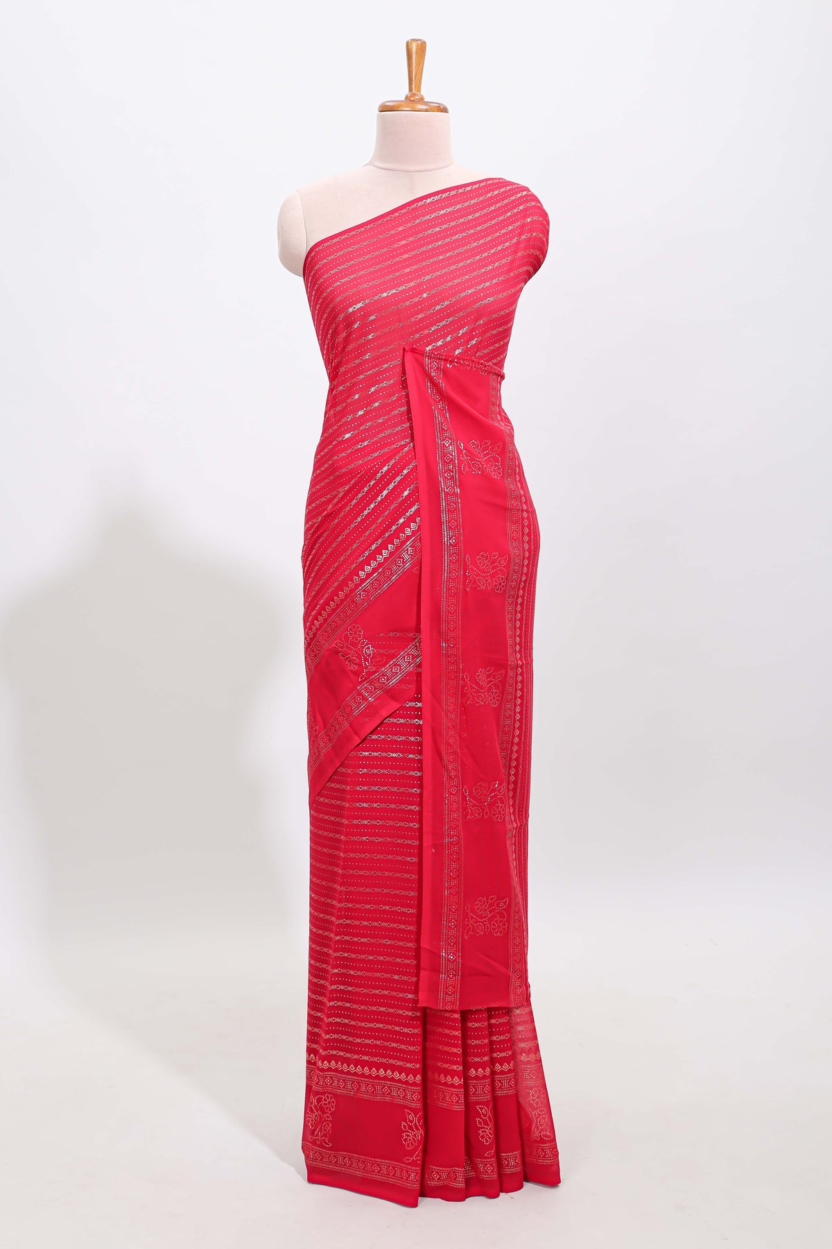 Pink vertical zari design georgette saree with self floral design border and matching blouse