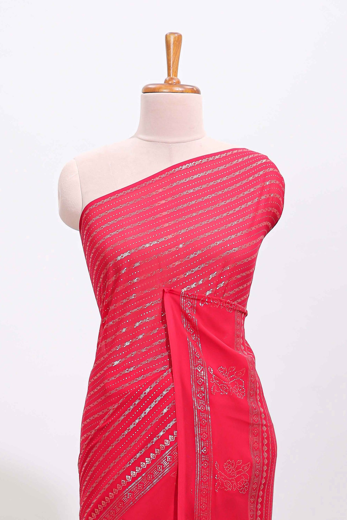 Pink vertical zari design georgette saree with self floral design border and matching blouse