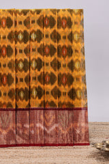 Mustard ikkat style motifs design ikkat cotton saree with contrast zari design border and plain blouse