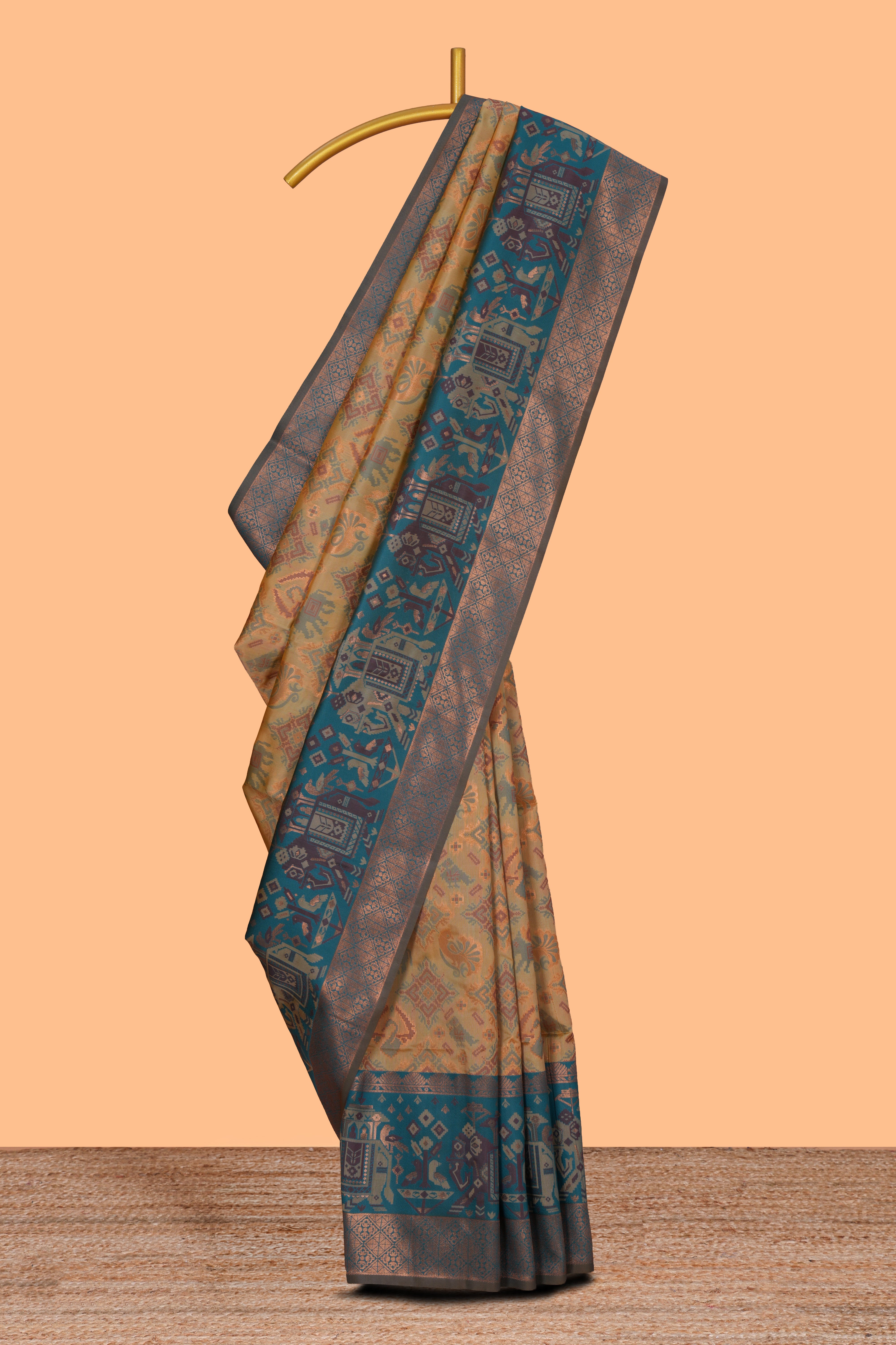 Mustard geometric & elephant motifs design ikkat cotton saree with contrast elephant design border and zari motifs blouse