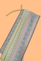 Green geometric motifs design ikkat cotton saree with contrast zari design border and zari floral motifs blouse