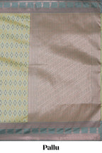 Green geometric motifs design ikkat cotton saree with contrast zari design border and zari floral motifs blouse