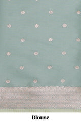 Green geometric motifs design ikkat cotton saree with contrast zari design border and zari floral motifs blouse