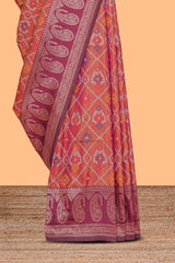 Orange floral design ikkat cotton saree with contrast zari design border and zari floral motifs blouse