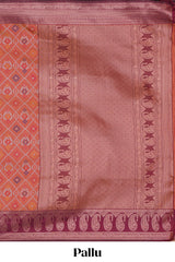 Orange floral design ikkat cotton saree with contrast zari design border and zari floral motifs blouse