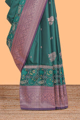 Green floral design zari motifs ikkat cotton saree with contrast zari design border and zari floral motifs blouse