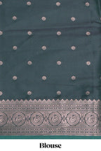 Green floral design zari motifs ikkat cotton saree with contrast zari design border and zari floral motifs blouse