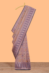 Pastel peach floral design zari motifs ikkat cotton saree with contrast zari design border and zari floral motifs blouse