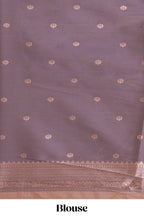 Pastel peach floral design zari motifs ikkat cotton saree with contrast zari design border and zari floral motifs blouse