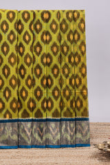 Green ikkat style motifs design ikkat cotton saree with contrast zari design border and plain blouse
