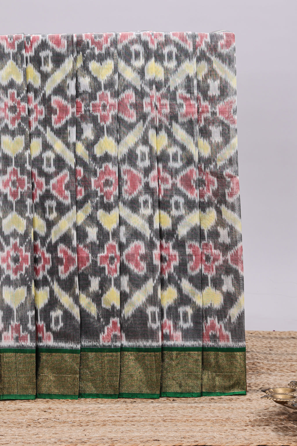 Grey ikkat style motifs design ikkat cotton saree with contrast zari design border and plain blouse