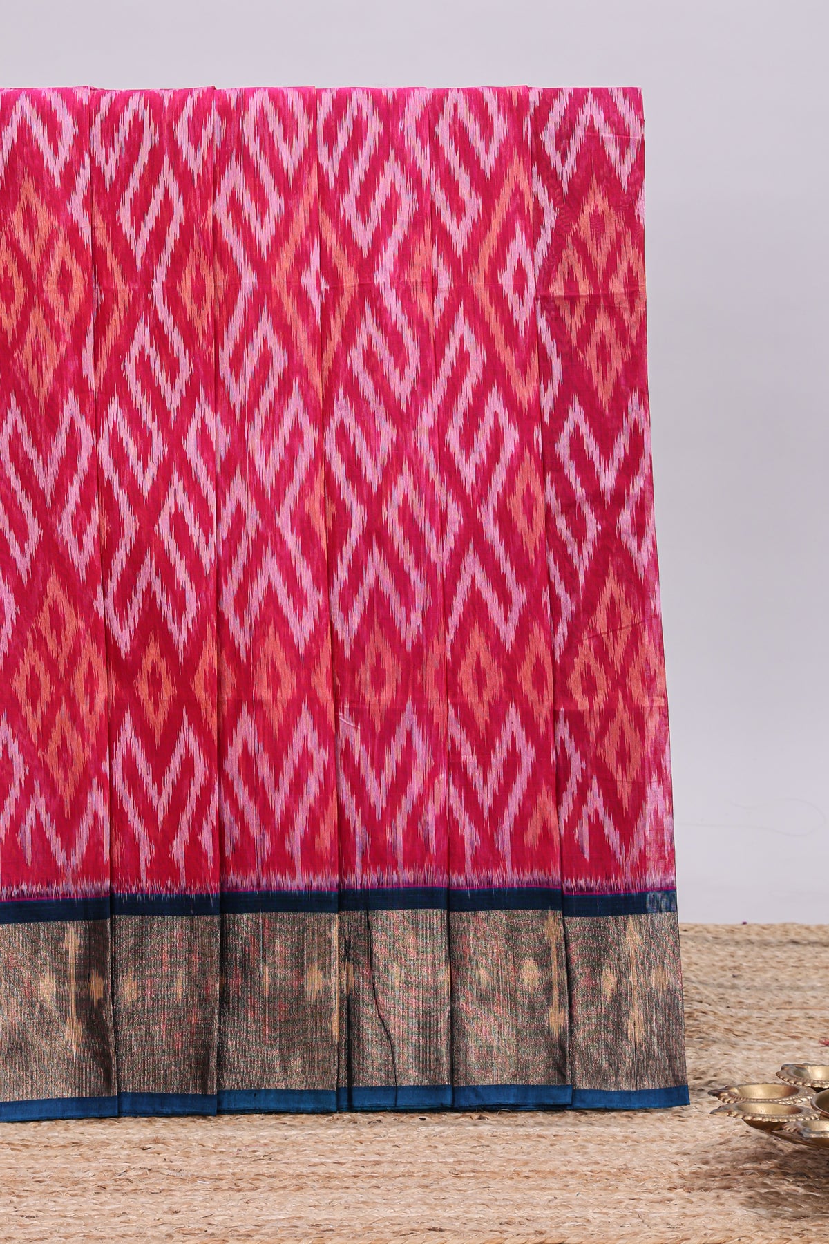 Pink ikkat style motifs design ikkat cotton saree with contrast zari design border and plain blouse