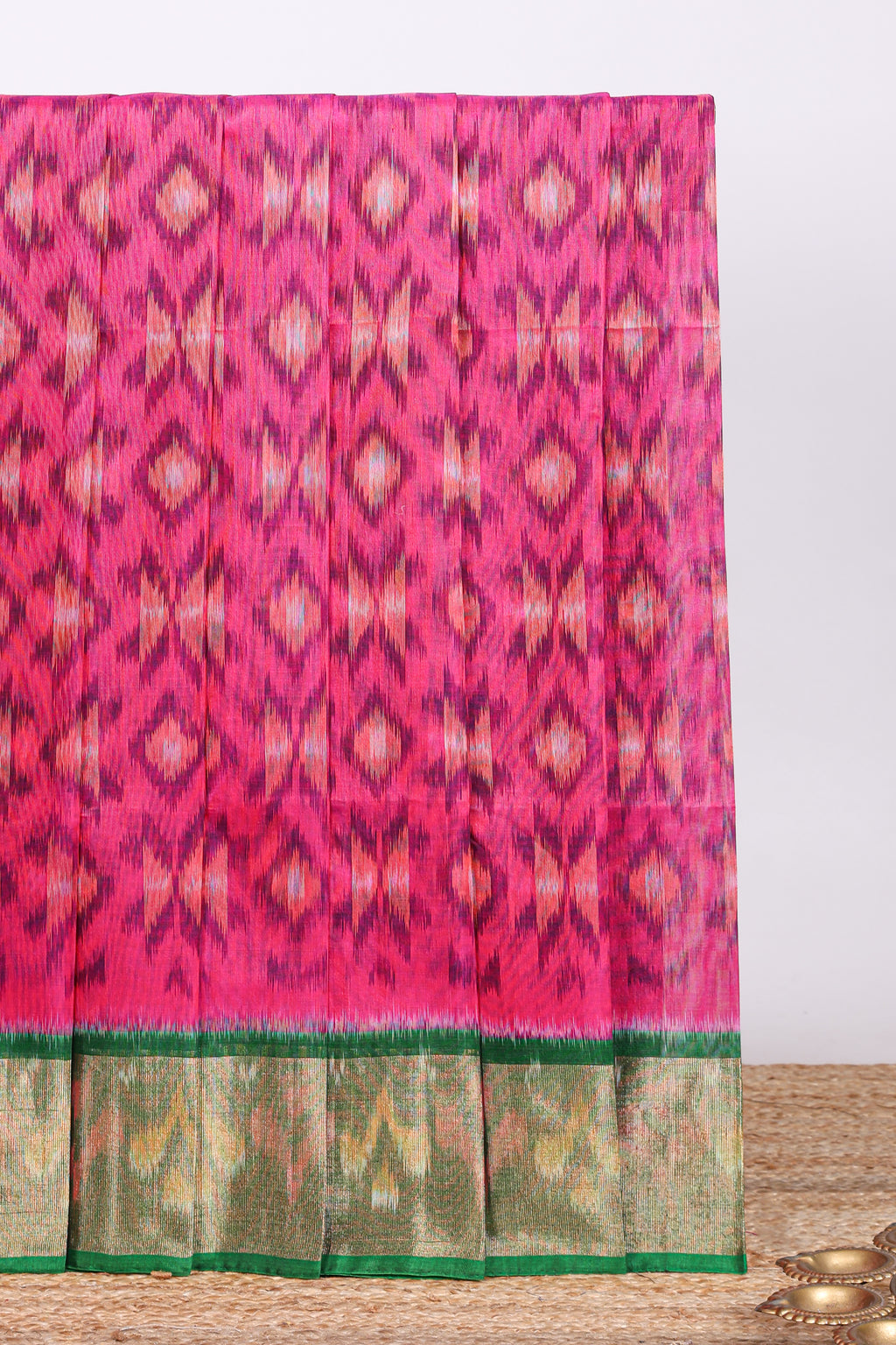 Pink ikkat design cotton saree with contrast zari border and plain blouse