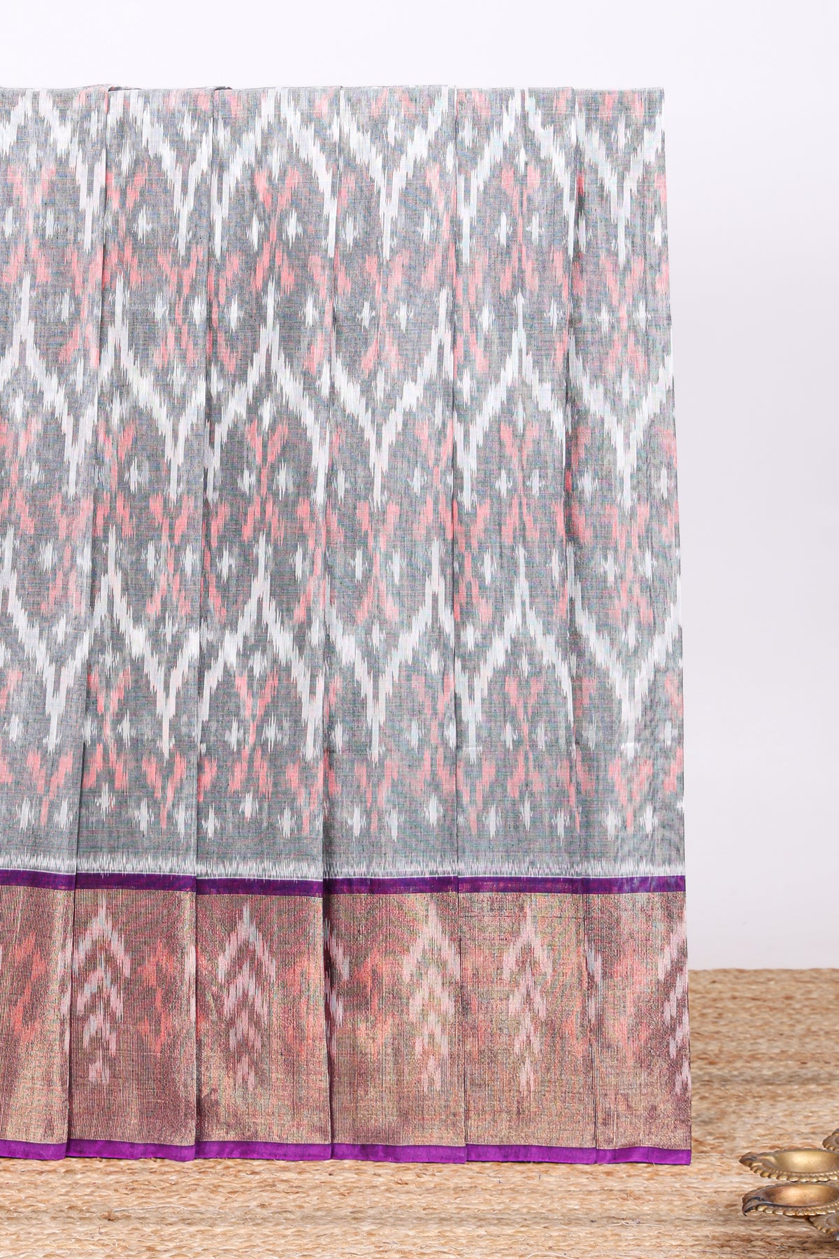 Grey ikkat design cotton saree with contrast zari border and violet Pallu and blouse
