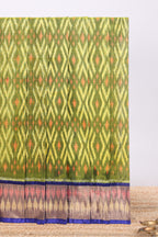 Green Geometric design ikkat cotton saree with contrast zari border and blouse