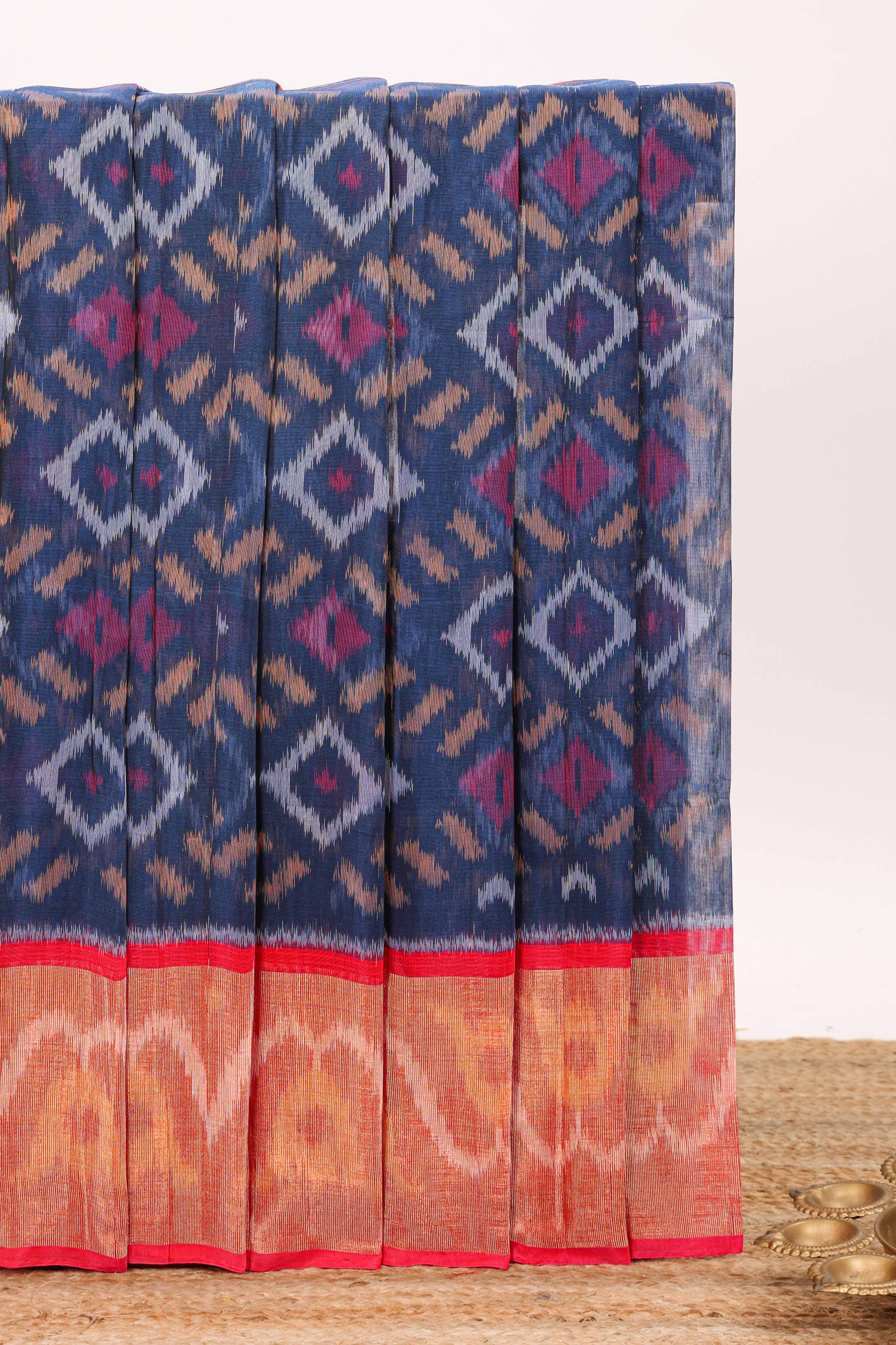 Blue geometric design ikkat cotton saree with contrast border and blouse
