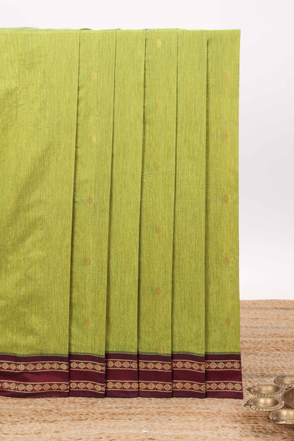 Green butta designed kalyani cotton saree with contrast border and zari designed pallu with plain blouse