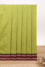 Green butta designed kalyani cotton saree with contrast border and zari designed pallu with plain blouse