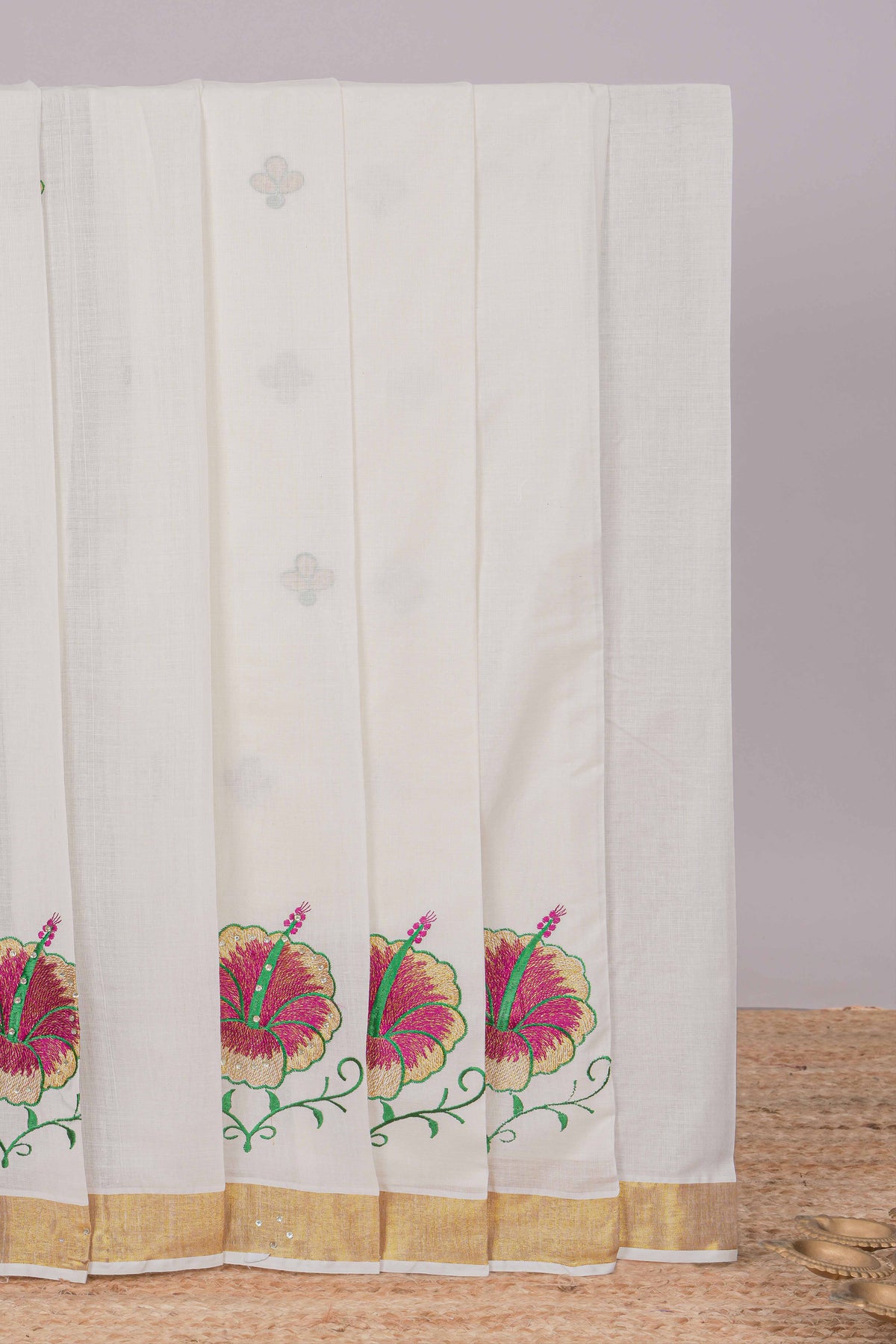 Cream floral design kerala cotton saree with self zari border and matching blouse