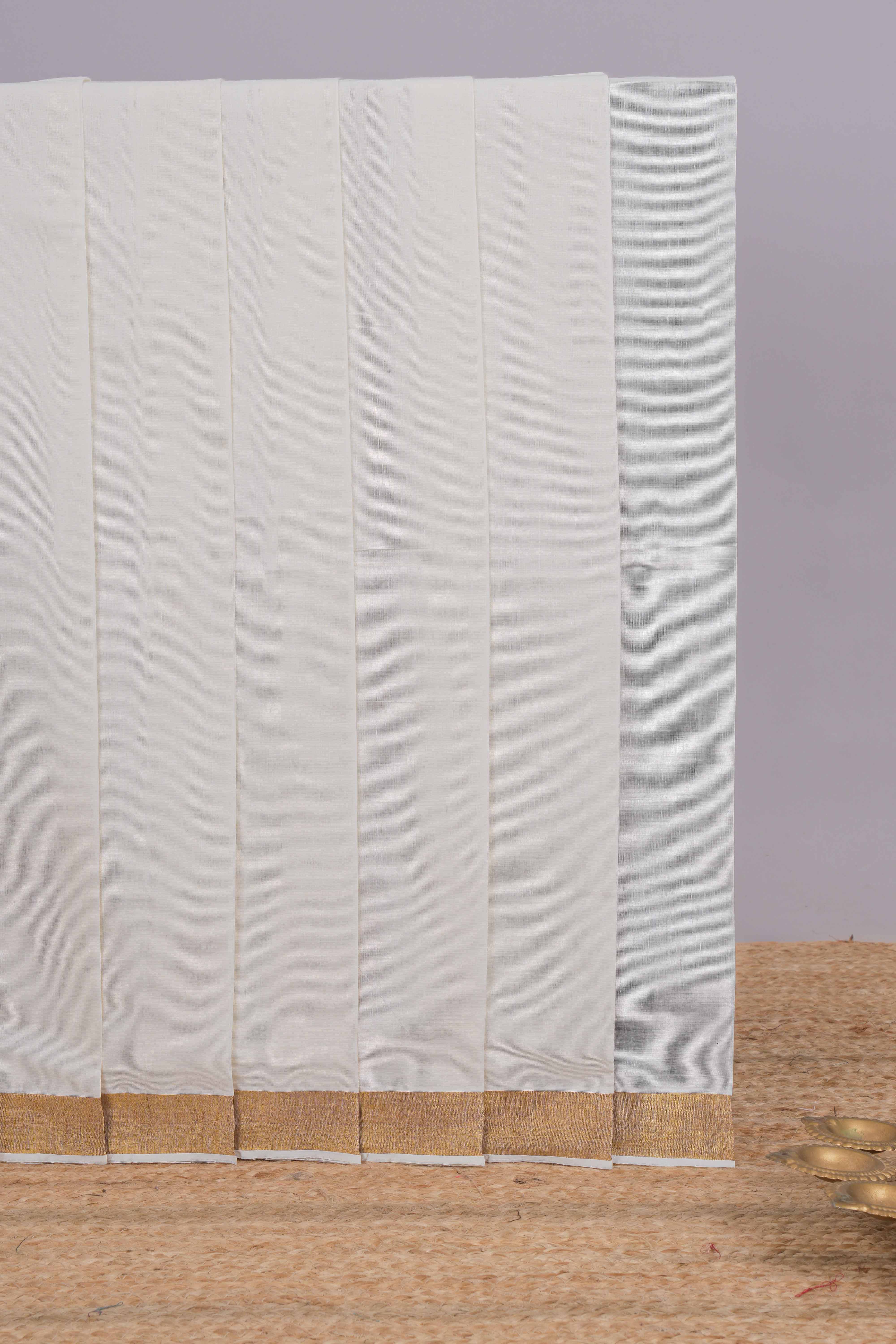 White plain design kerala cotton saree with self zari border and matching blouse