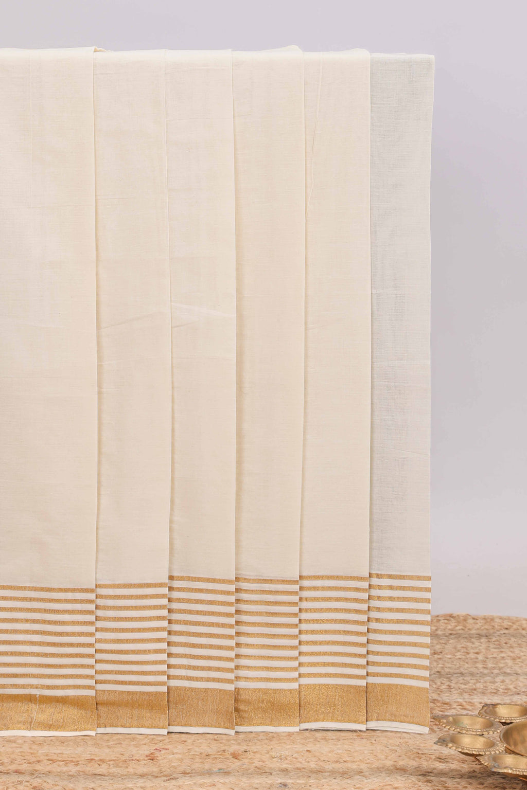 Cream plain design kerala cotton saree with self zari border and matching blouse