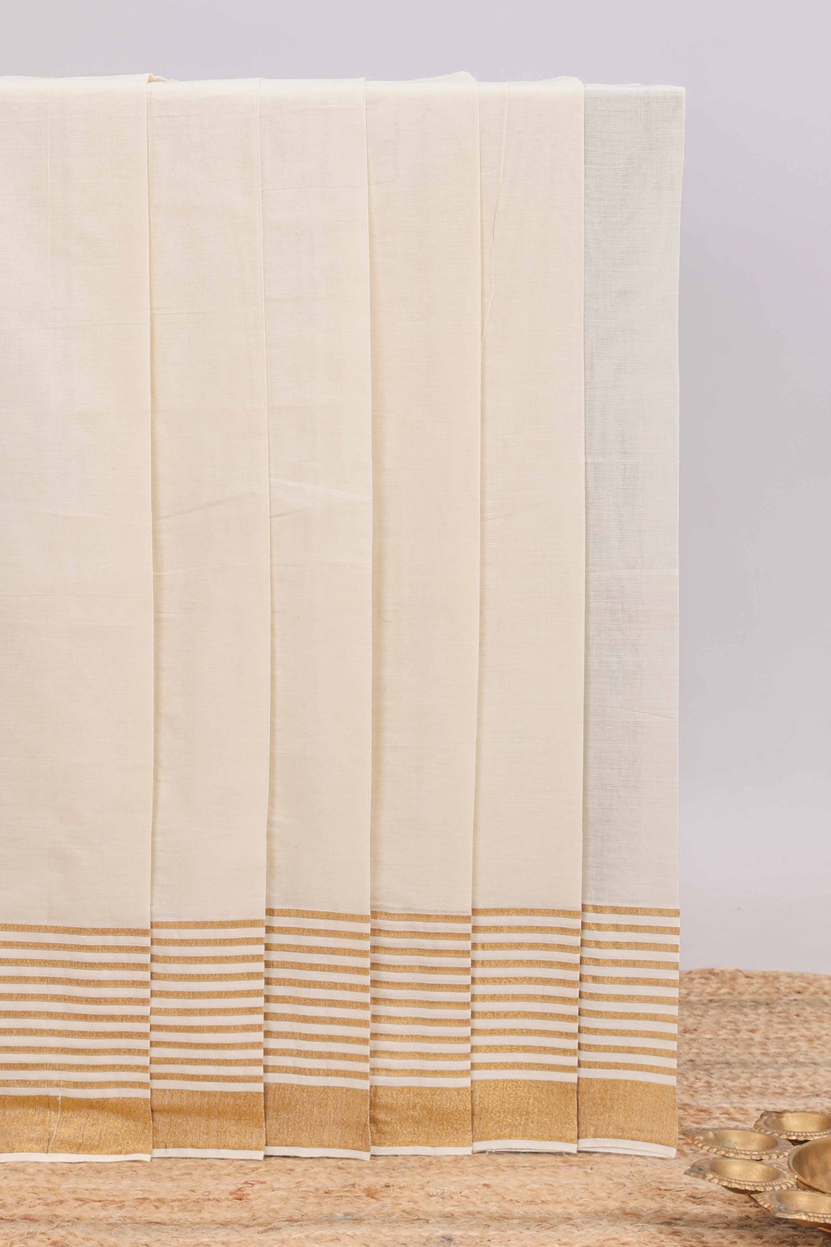 Cream plain design kerala cotton saree with self zari border and matching blouse