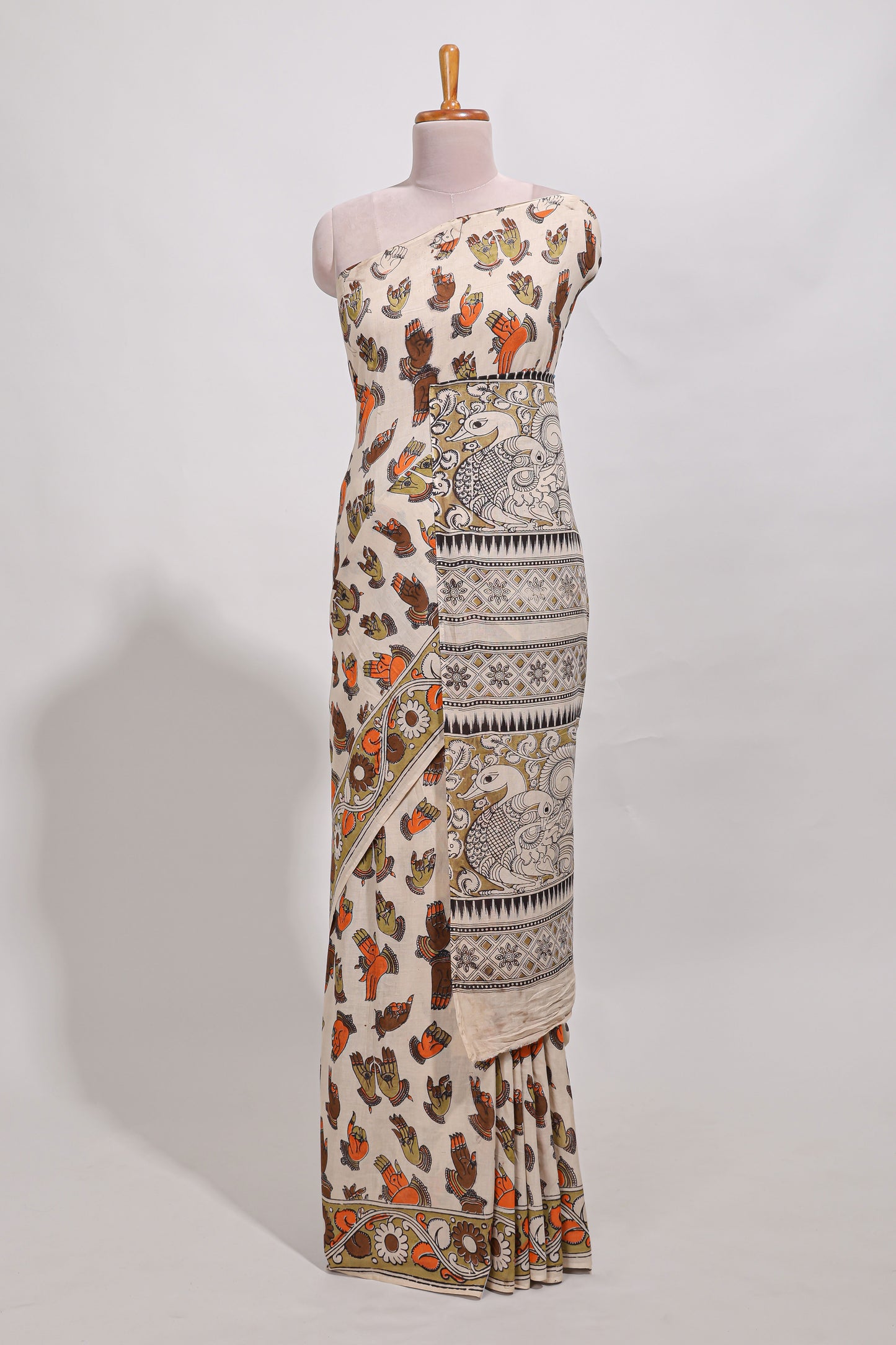 Multicolour kalamkari printed cotton saree with traditional floral motifs and contrast pallu
