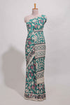 Green kalamkari printed cotton saree with traditional floral motifs and contrast pallu