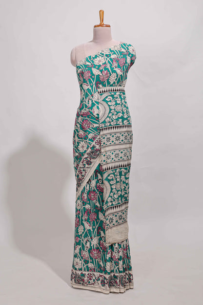 Green kalamkari printed cotton saree with traditional floral motifs and contrast pallu