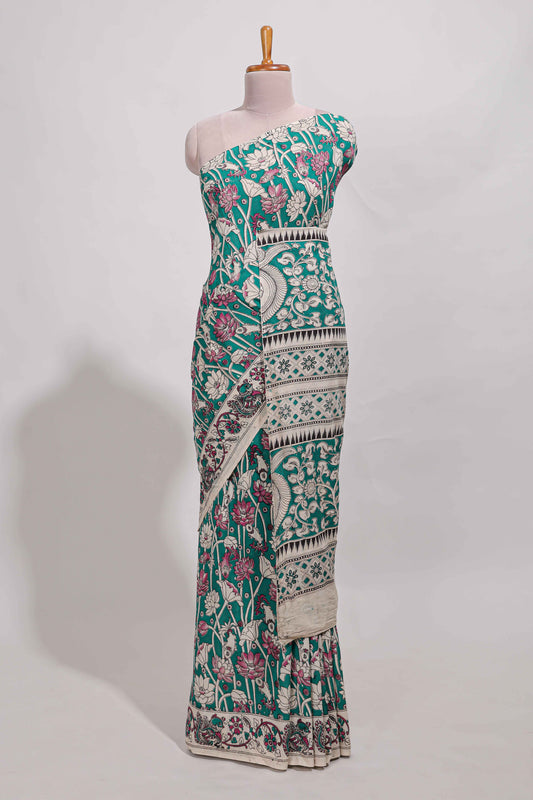 Green kalamkari printed cotton saree with traditional floral motifs and contrast pallu