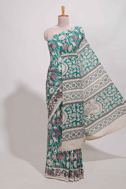 Green kalamkari printed cotton saree with traditional floral motifs and contrast pallu