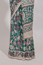 Green kalamkari printed cotton saree with traditional floral motifs and contrast pallu