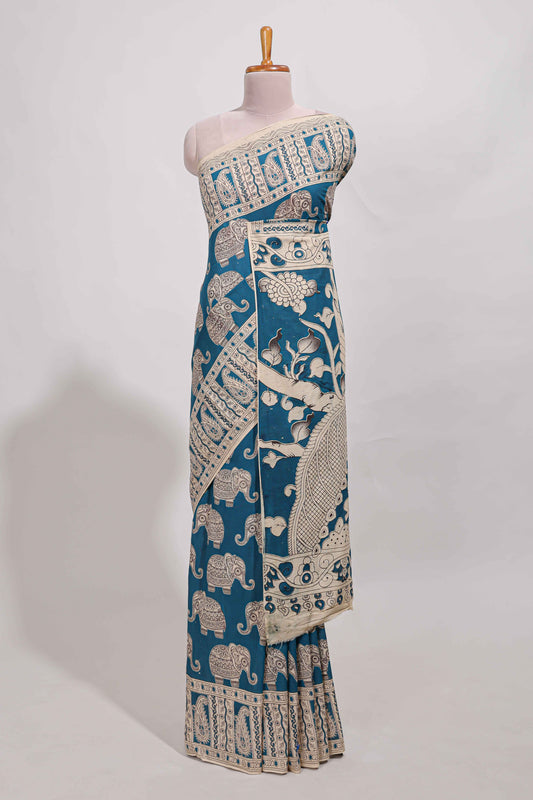 Blue kalamkari printed cotton saree with traditional floral motifs and contrast pallu
