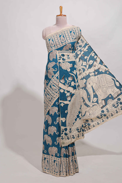 Blue kalamkari printed cotton saree with traditional floral motifs and contrast pallu