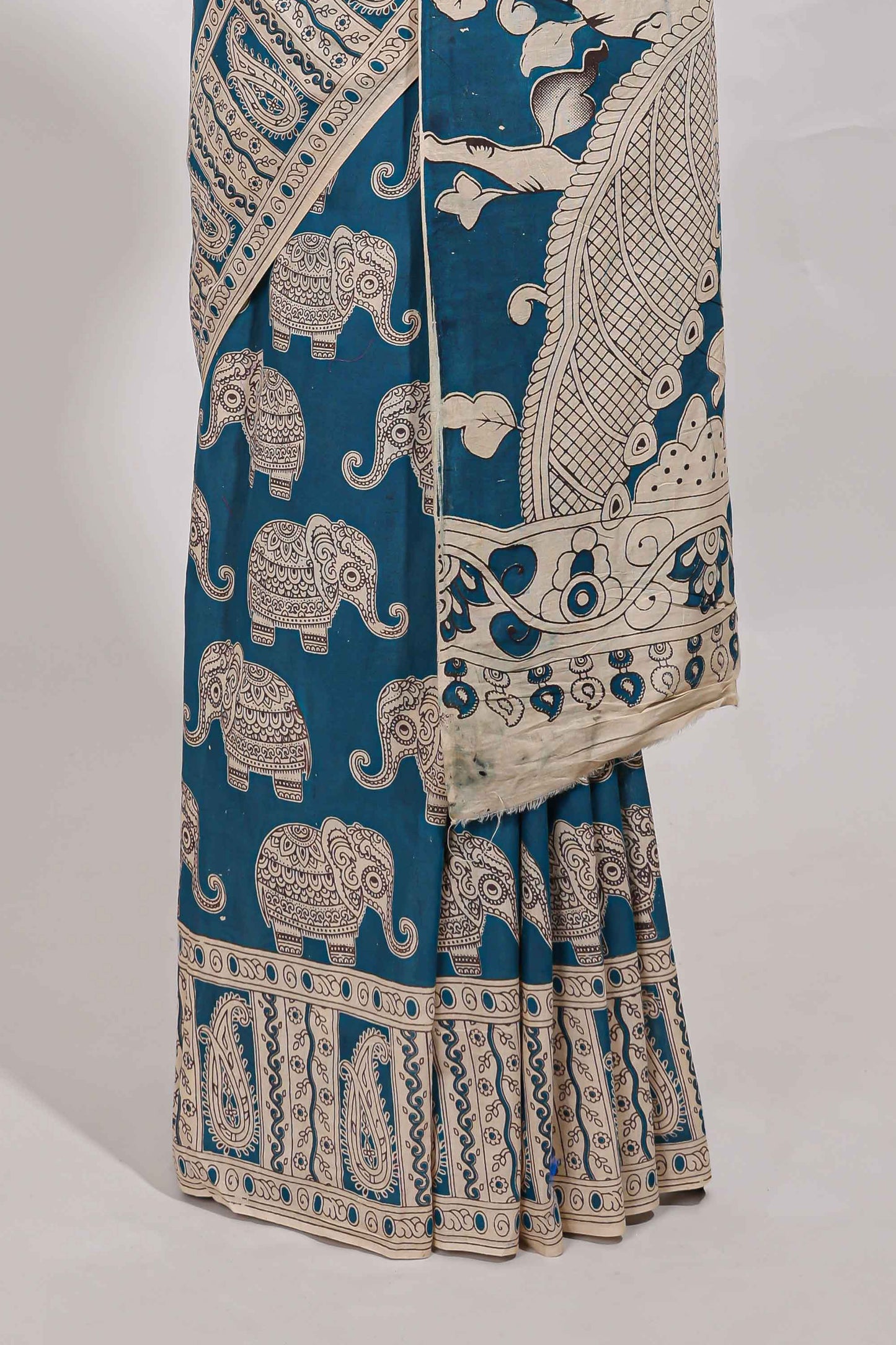 Blue kalamkari printed cotton saree with traditional floral motifs and contrast pallu