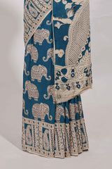 Blue kalamkari printed cotton saree with traditional floral motifs and contrast pallu