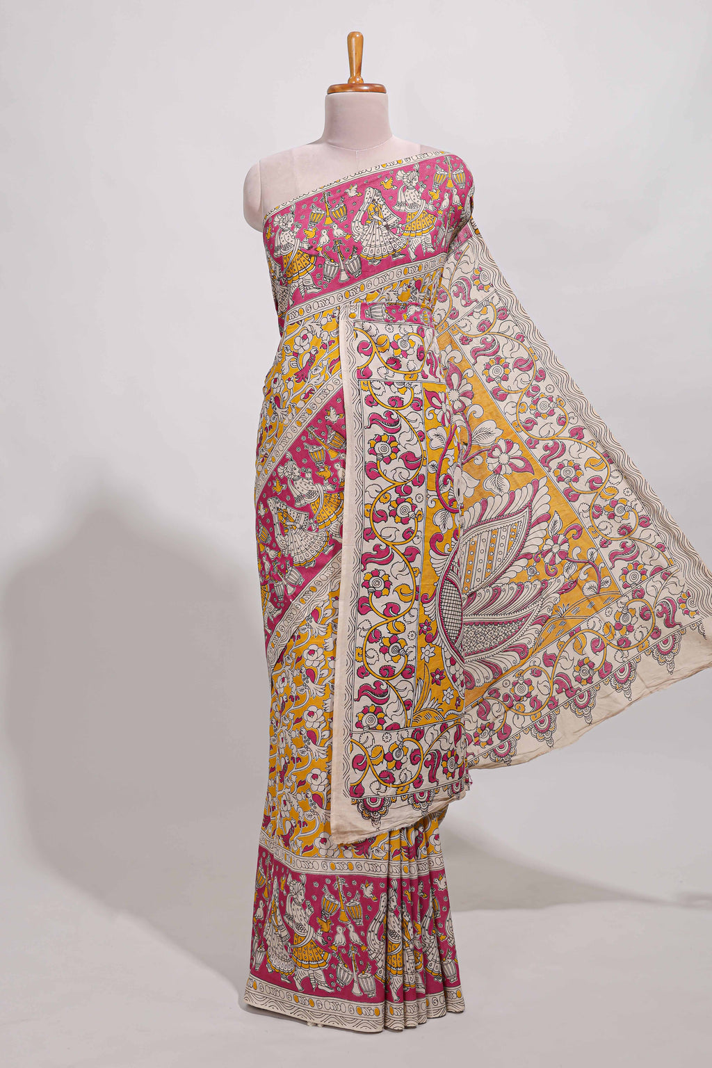yellow kalamkari printed cotton saree with traditional floral motifs and contrast pallu