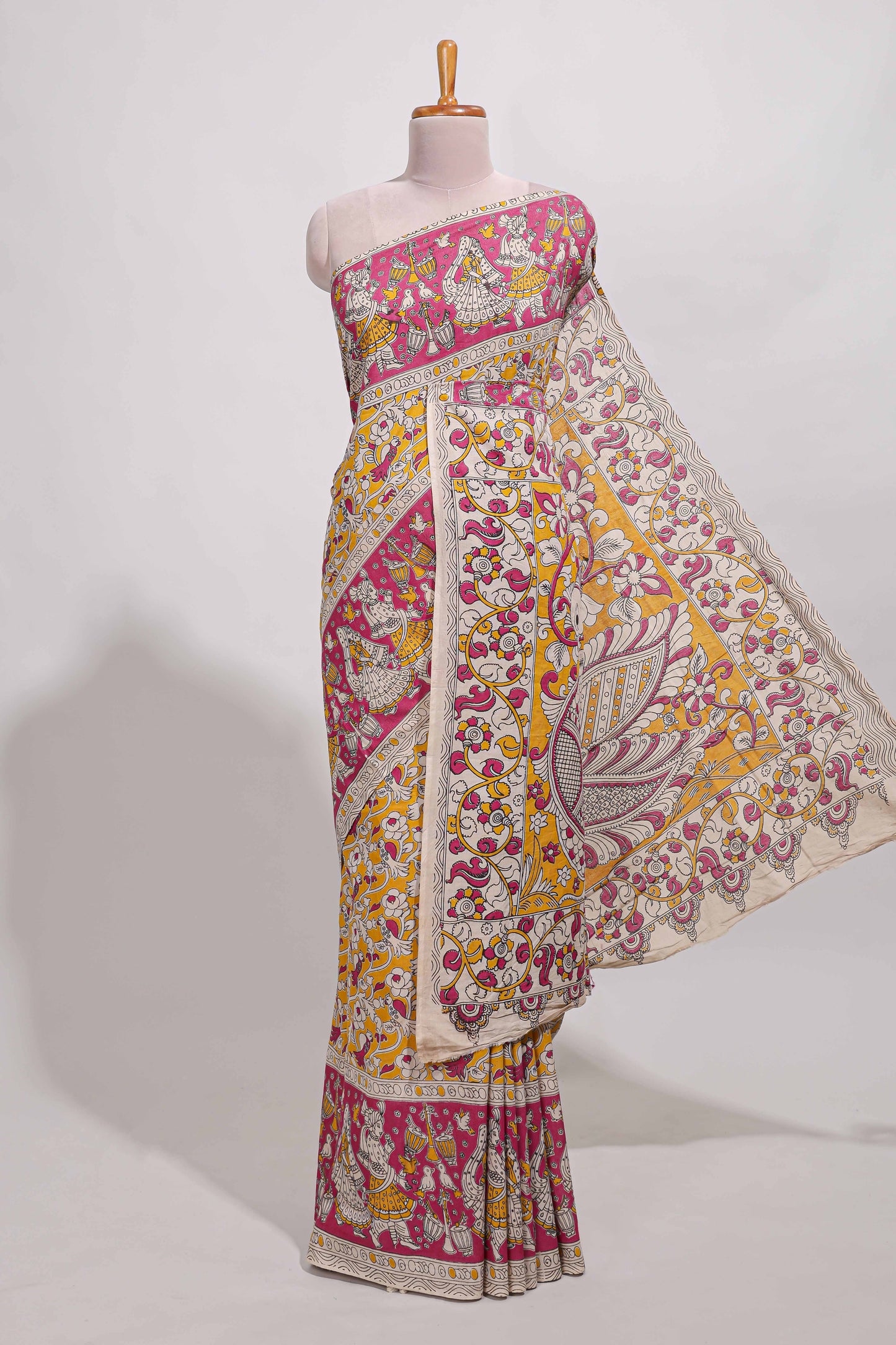 yellow kalamkari printed cotton saree with traditional floral motifs and contrast pallu