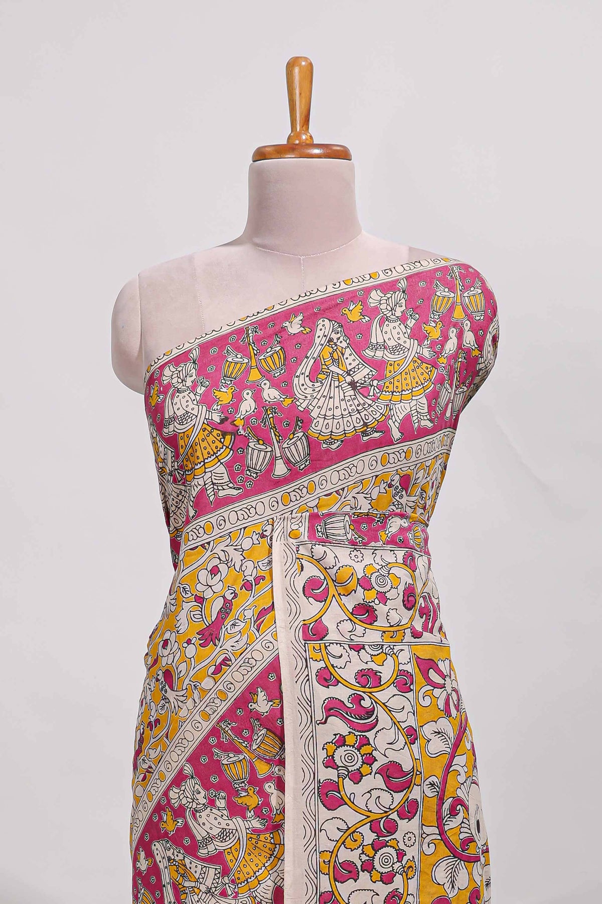 yellow kalamkari printed cotton saree with traditional floral motifs and contrast pallu