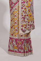 yellow kalamkari printed cotton saree with traditional floral motifs and contrast pallu