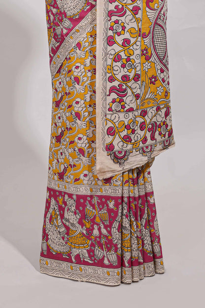 yellow kalamkari printed cotton saree with traditional floral motifs and contrast pallu