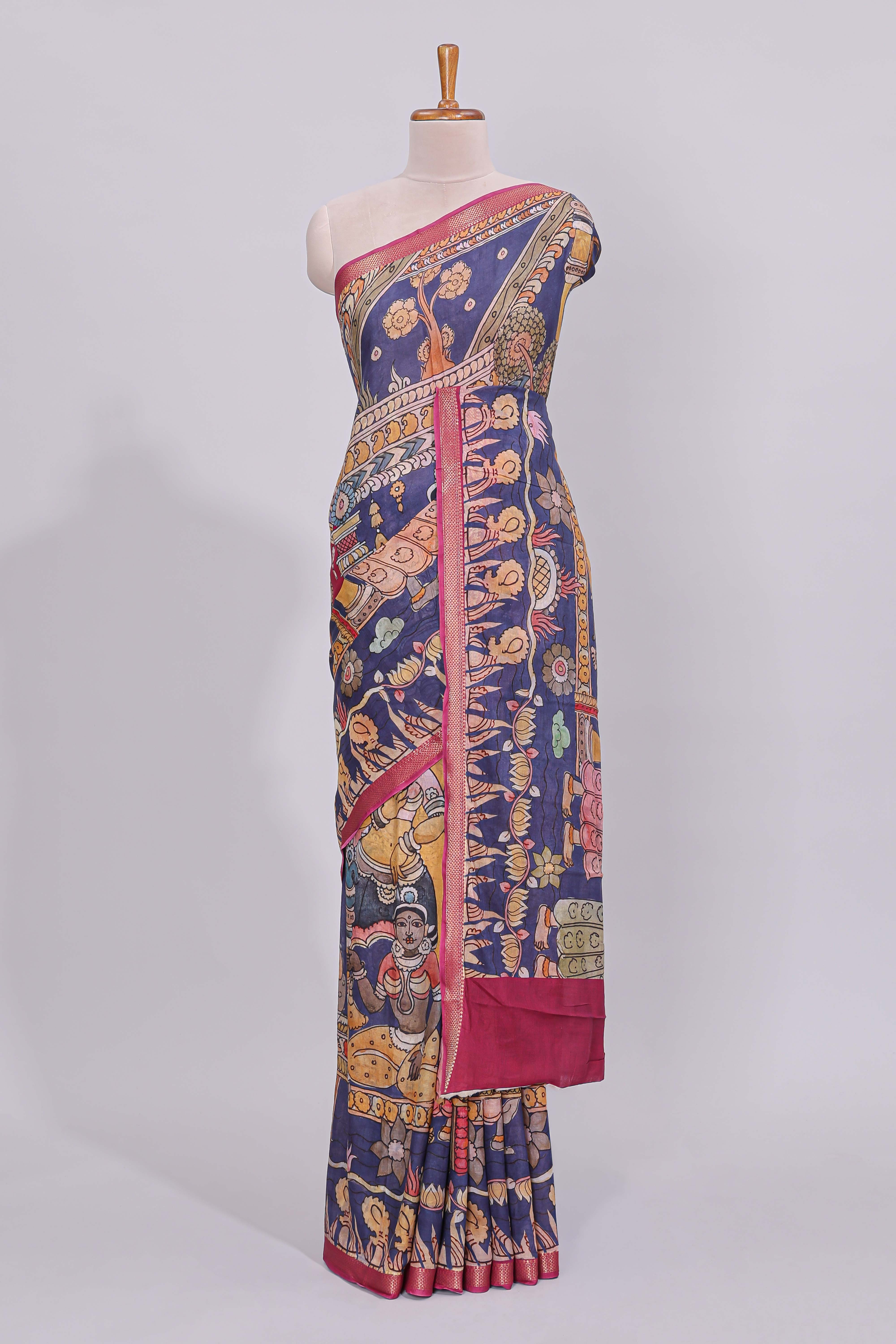 Blue traditional motifs kalamkari cotton saree with contrast zari border and floral motifs blouse