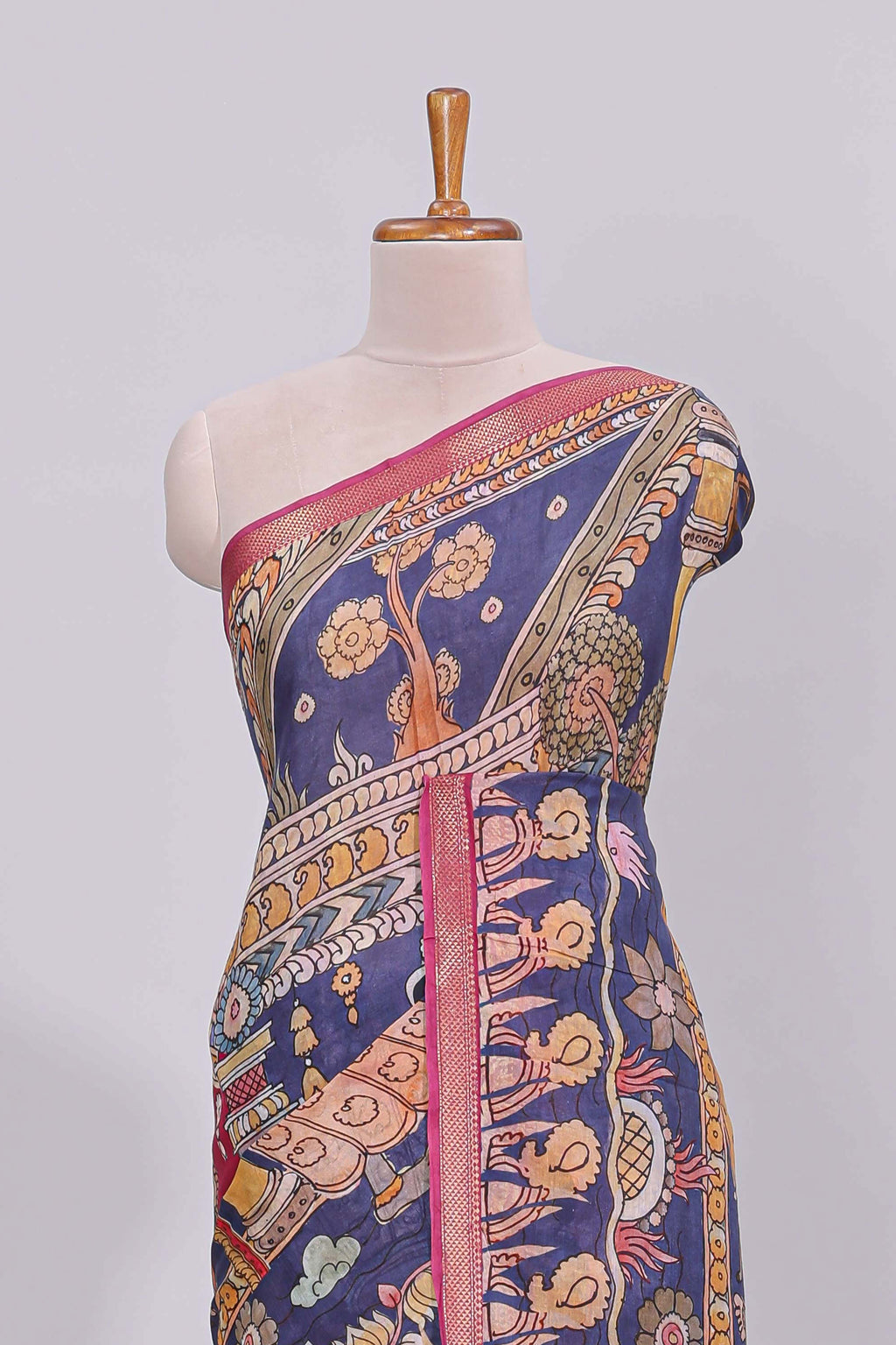 Blue traditional motifs kalamkari cotton saree with contrast zari border and floral motifs blouse