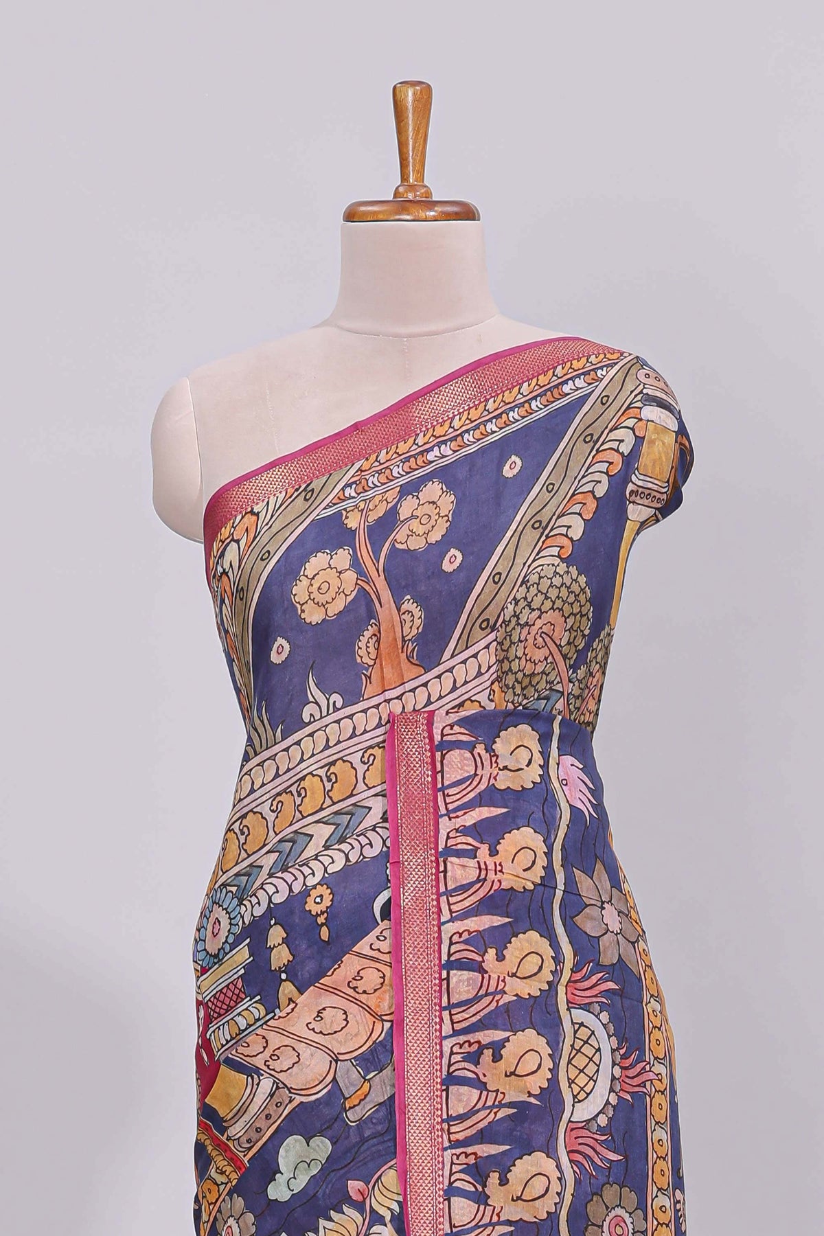 Blue traditional motifs kalamkari cotton saree with contrast zari border and floral motifs blouse