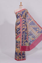 Blue traditional motifs kalamkari cotton saree with contrast zari border and floral motifs blouse