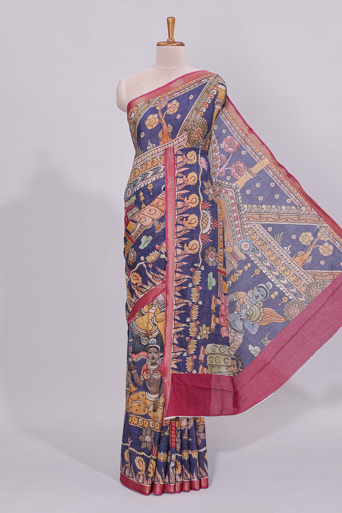 Blue traditional motifs kalamkari cotton saree with contrast zari border and floral motifs blouse