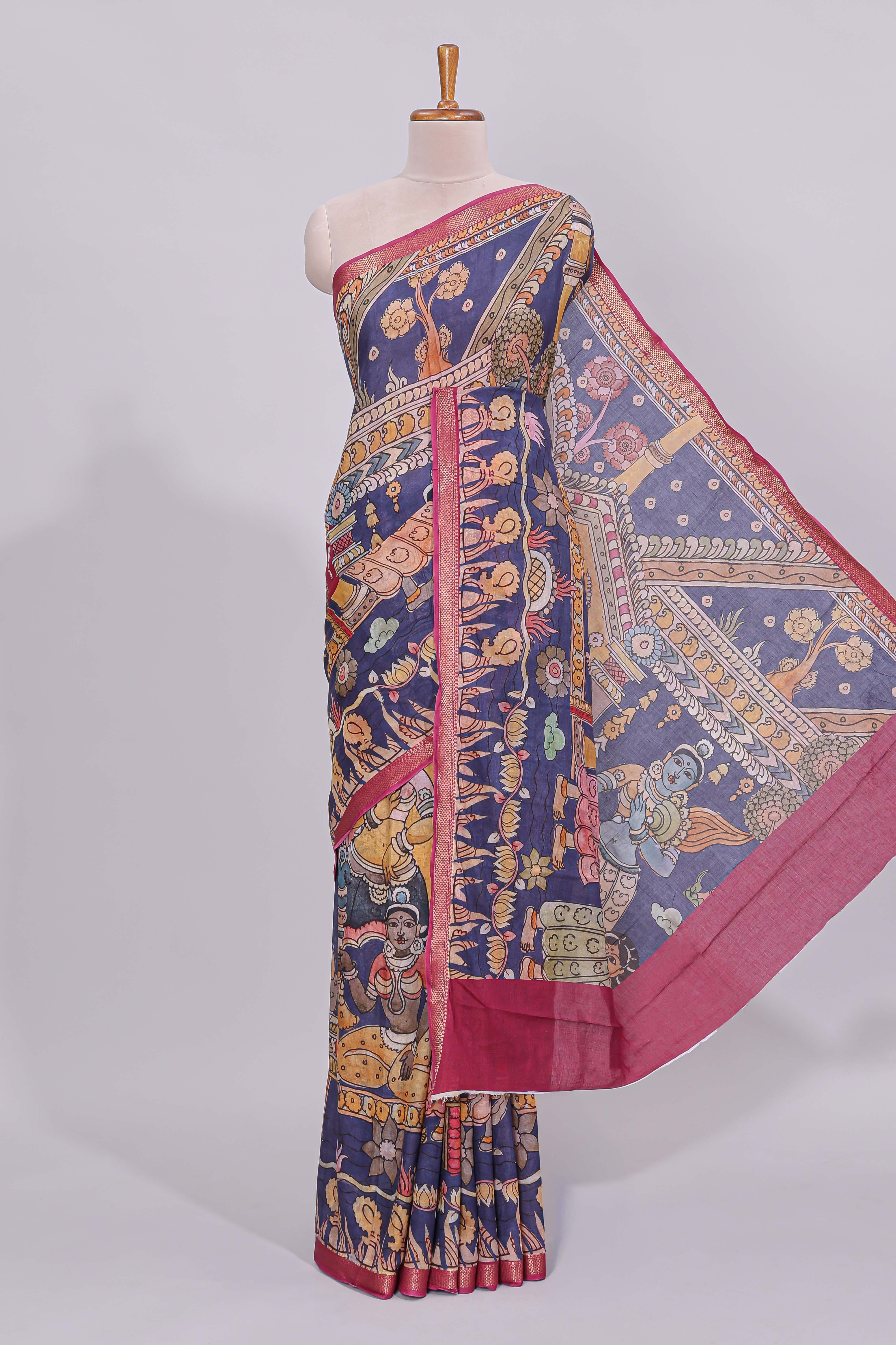 Blue traditional motifs kalamkari cotton saree with contrast zari border and floral motifs blouse