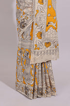 Yellow hand painted peacock & floral design kalamkari cotton saree with contrast border and floral printed blouse
